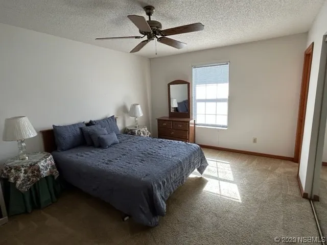 a bedroom with bed and window