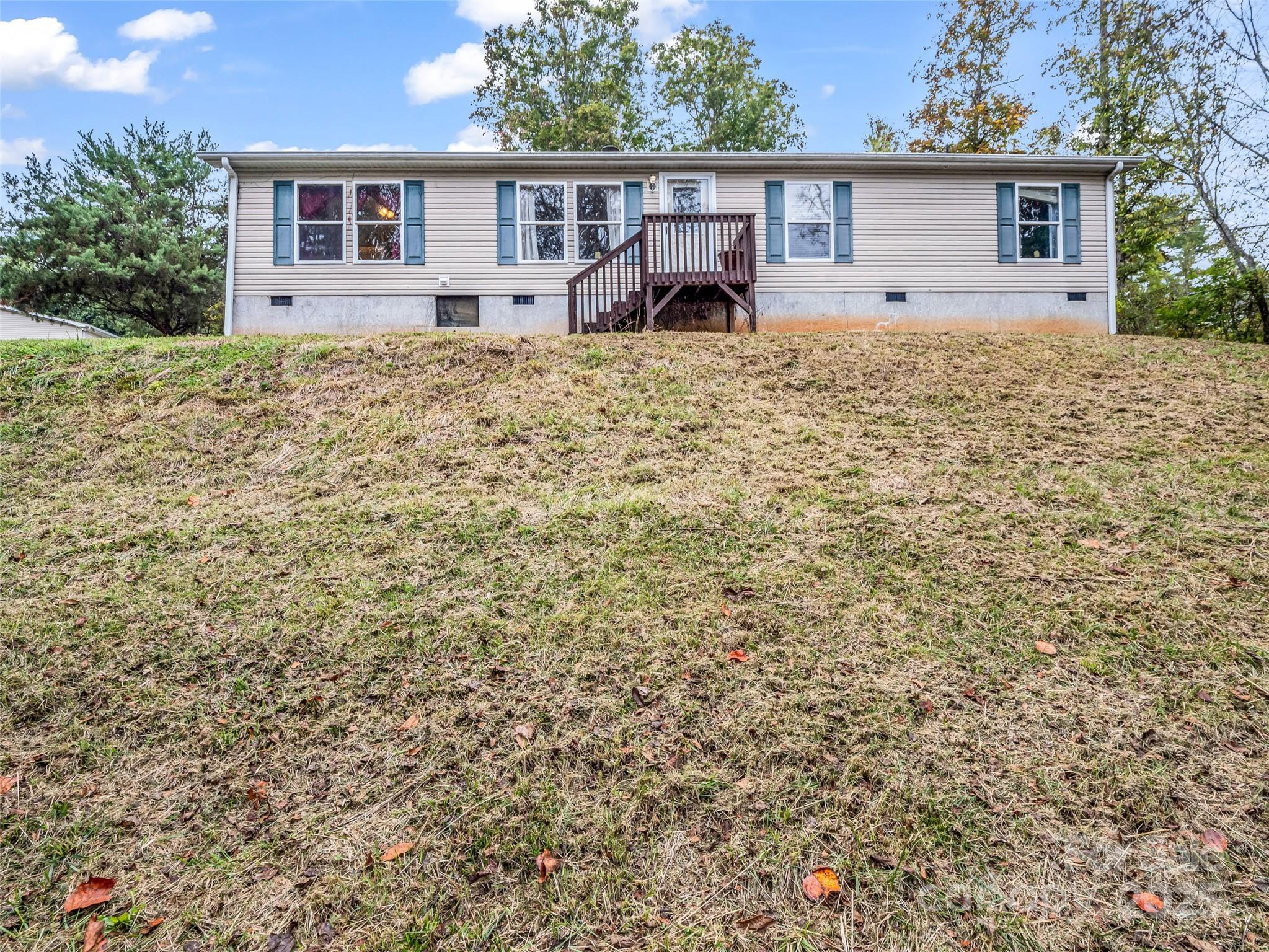 114 Leonards Lane Weaverville, NC 28787 - Photo 1 of 34 a house with trees in the background