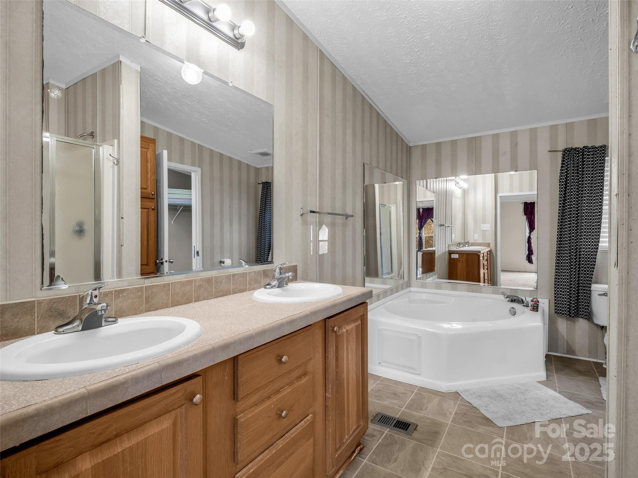 114 Leonards Lane Weaverville, NC 28787 - Photo 17 of 34 a bathroom with a sink a toilet and shower