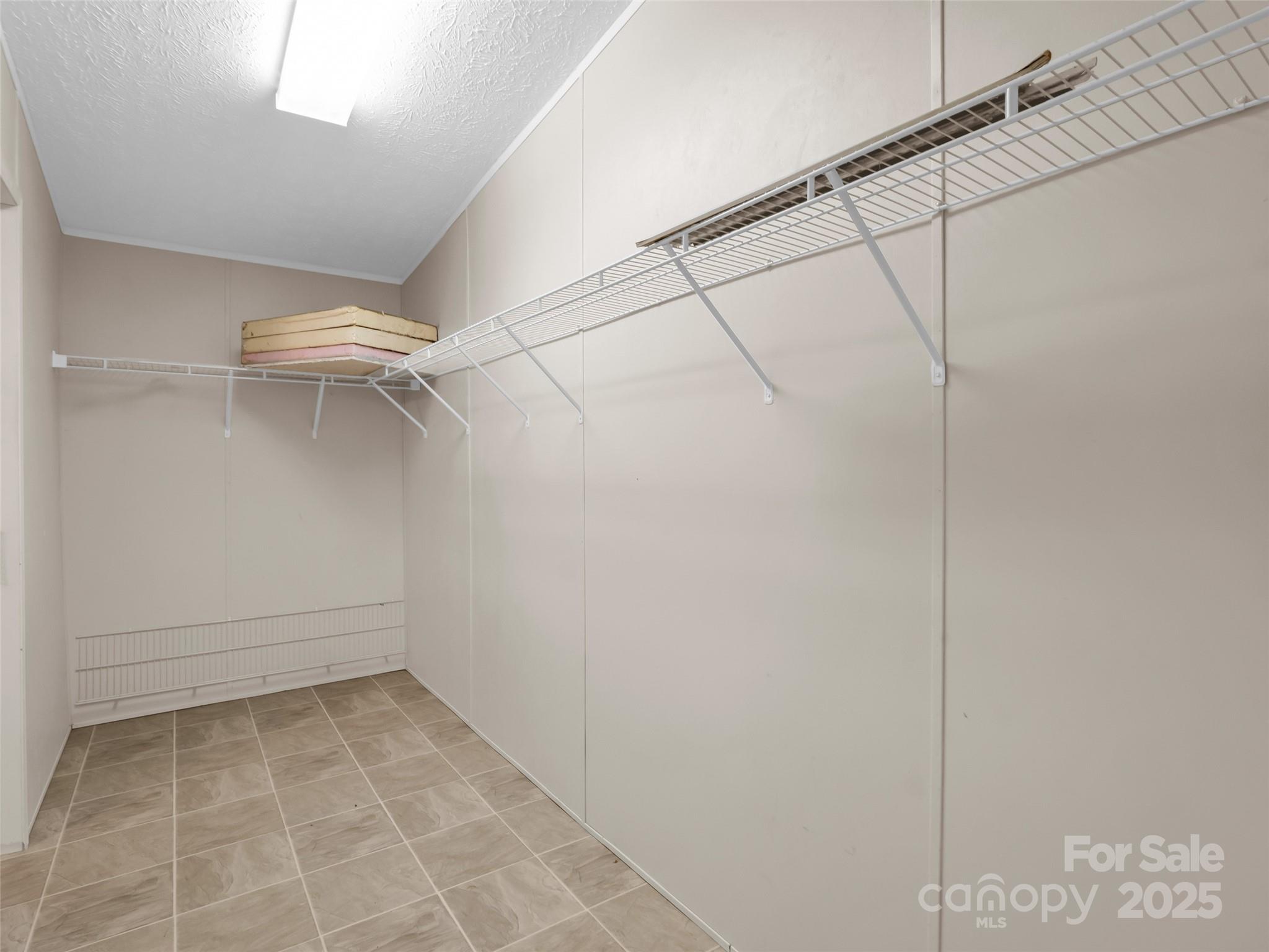 114 Leonards Lane Weaverville, NC 28787 - Photo 20 of 34 a view of a room with racks on the wall