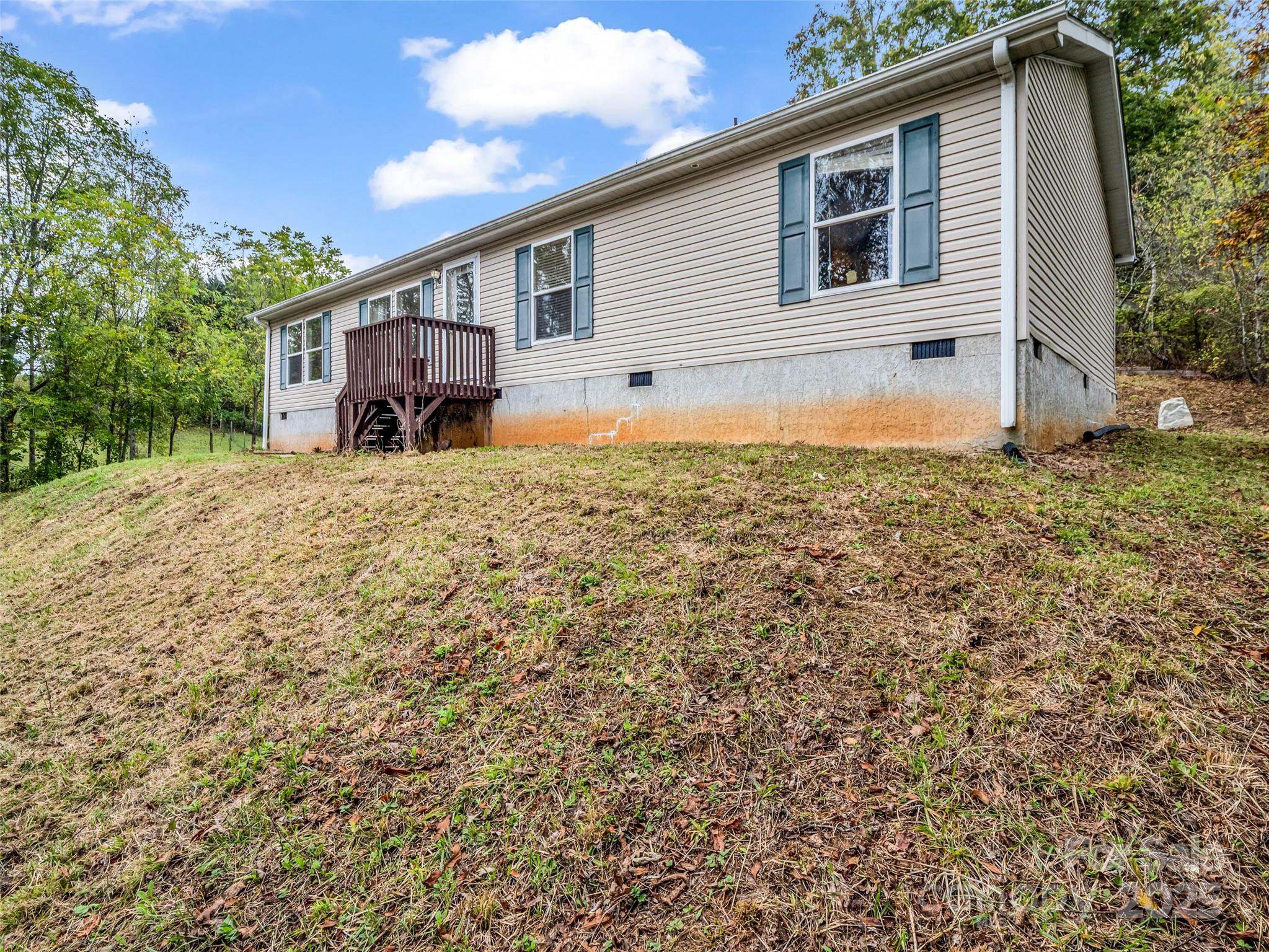 114 Leonards Lane Weaverville, NC 28787 - Photo 2 of 34 a front view of a house with a yard