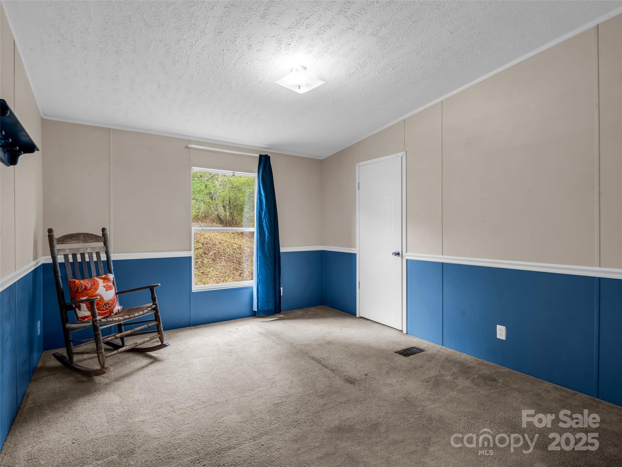 114 Leonards Lane Weaverville, NC 28787 - Photo 21 of 34 a bedroom with furniture and a window