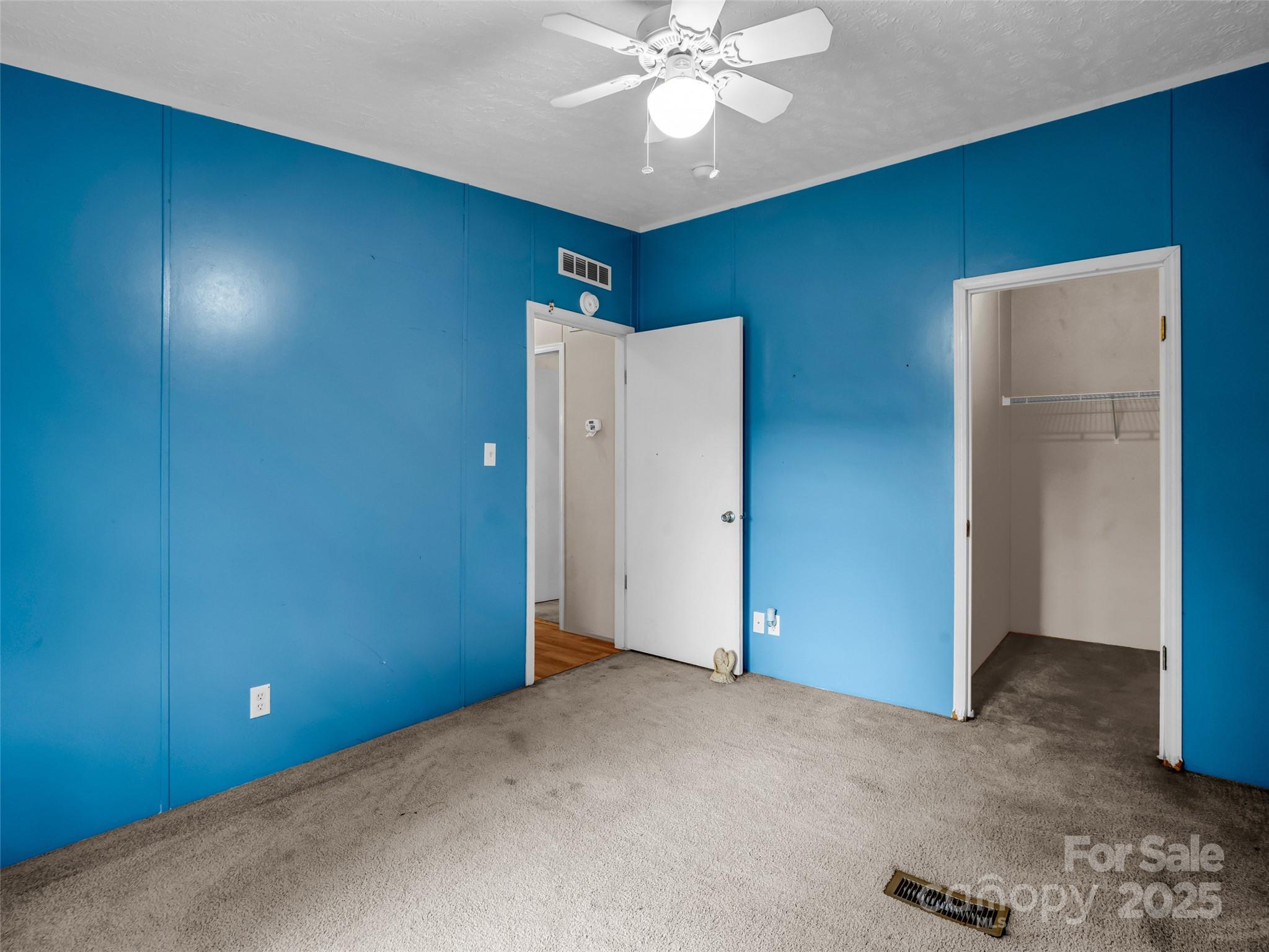 114 Leonards Lane Weaverville, NC 28787 - Photo 24 of 34 a view of a livingroom with a chandelier fan
