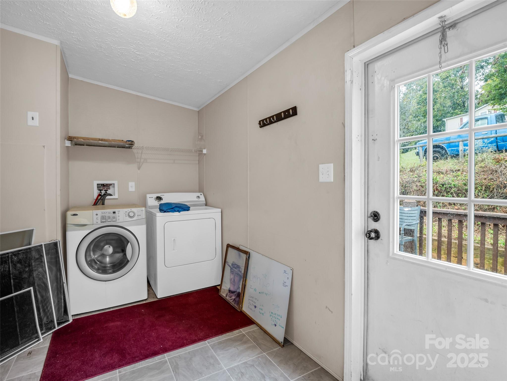 114 Leonards Lane Weaverville, NC 28787 - Photo 26 of 34 a utility room with dryer and washer