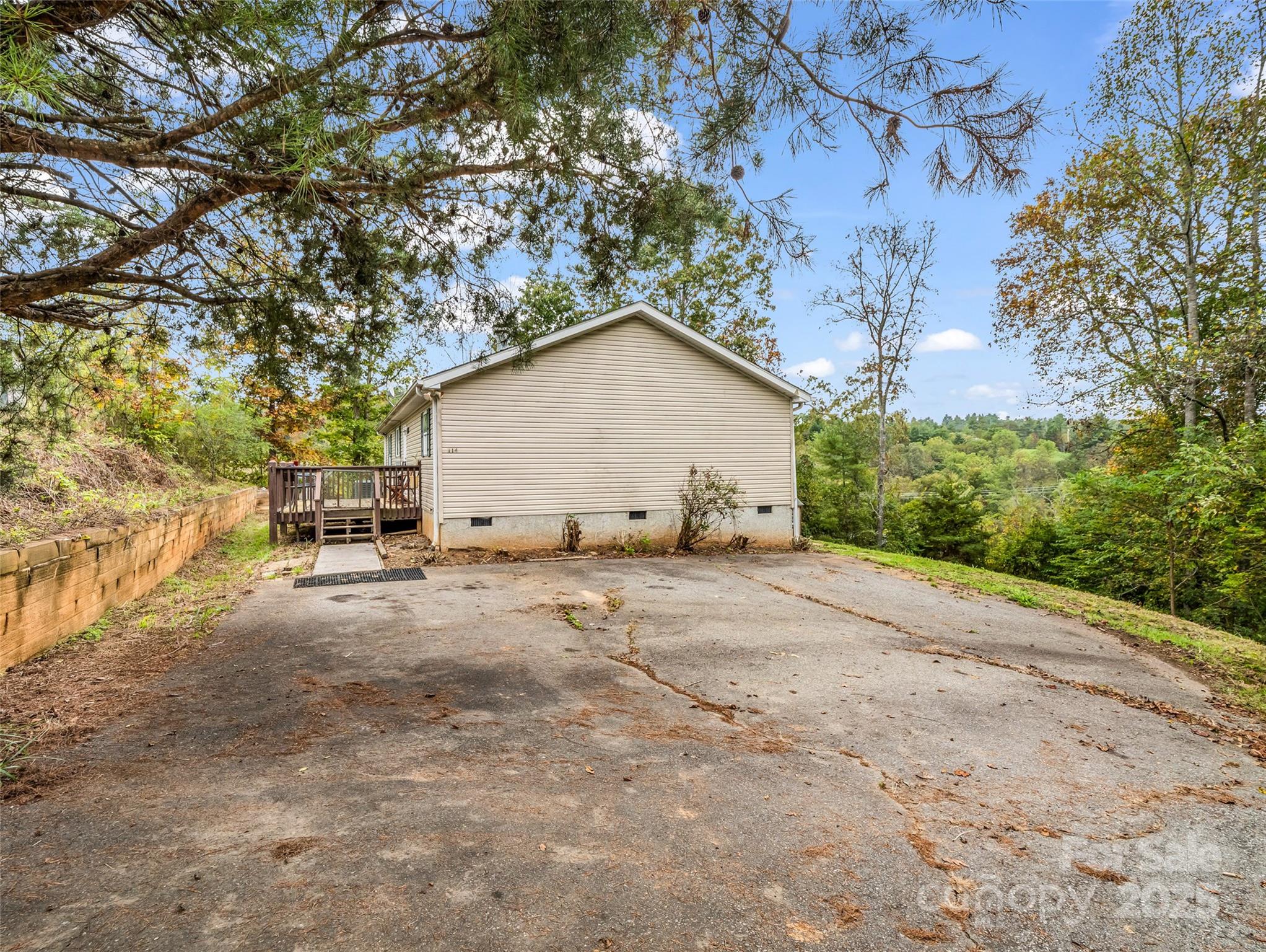 114 Leonards Lane Weaverville, NC 28787 - Photo 30 of 34 a view of a house with a yard and garage