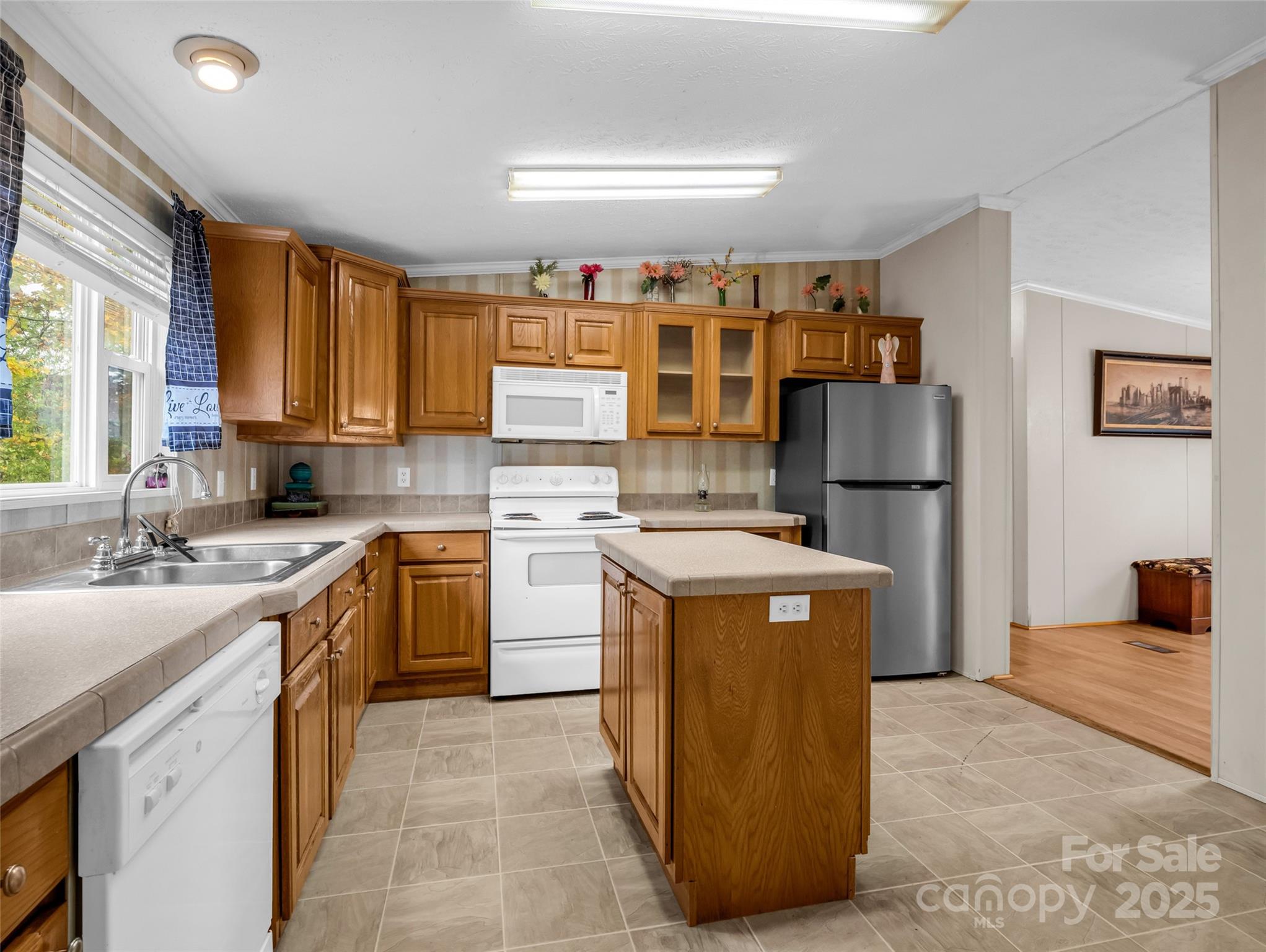 114 Leonards Lane Weaverville, NC 28787 - Photo 10 of 34 a kitchen with a stove a sink and a refrigerator