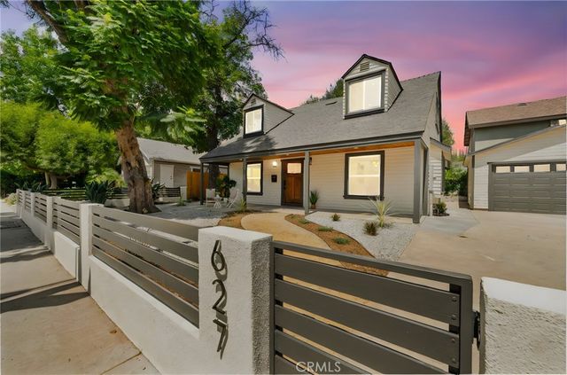 a front view of residential houses with yard