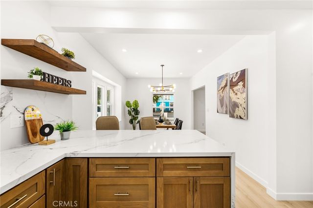 a kitchen that has a sink and a stove