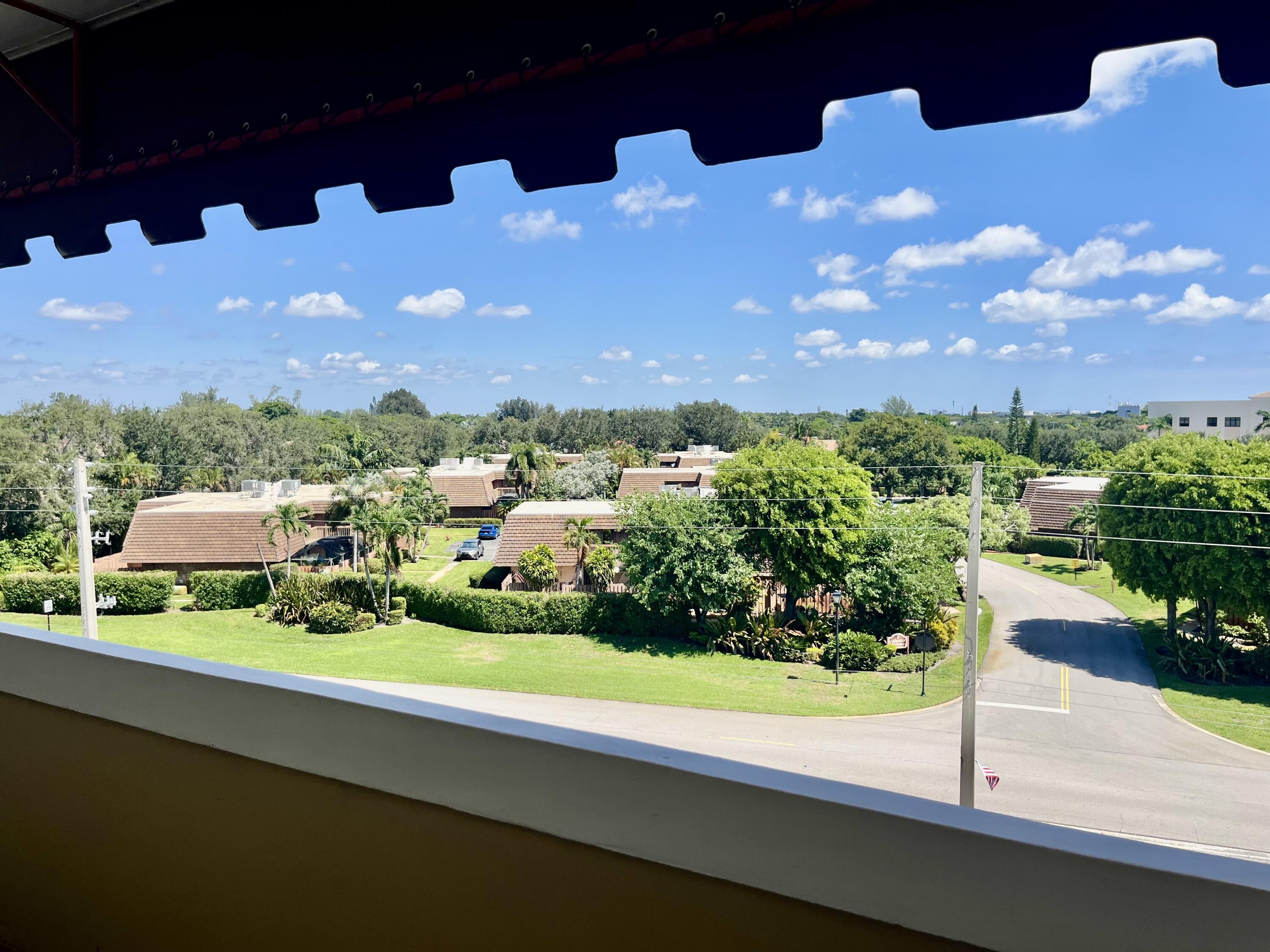 145 Atlantis Boulevard, Unit PH4 Atlantis, FL 33462 - Photo 20 of 27 a view of a city street from a balcony