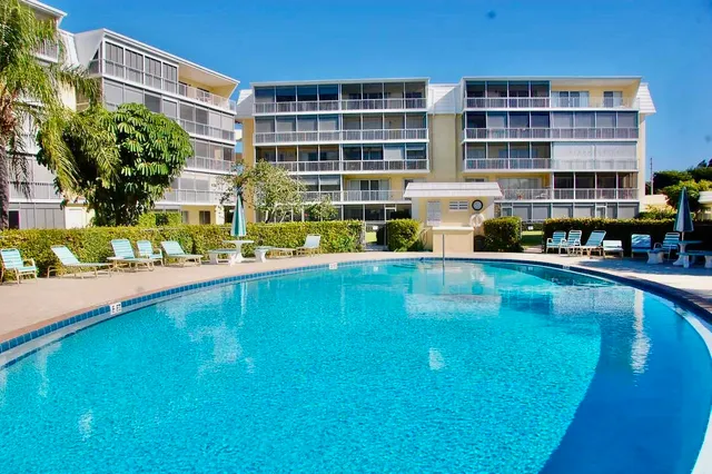 an outdoor space with furniture and city view