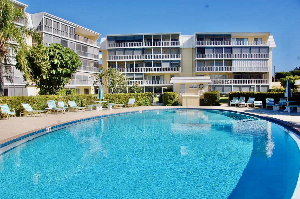 145 Atlantis Boulevard, Unit PH4 Atlantis, FL 33462 - Photo 24 of 27 a swimming pool view with a outdoor seating space
