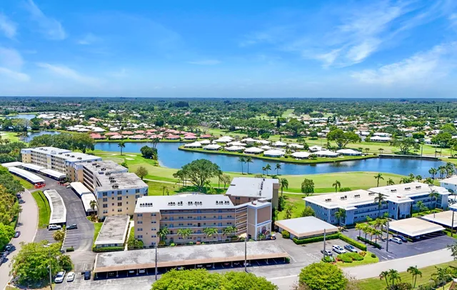 a view of a garden with a building in the background