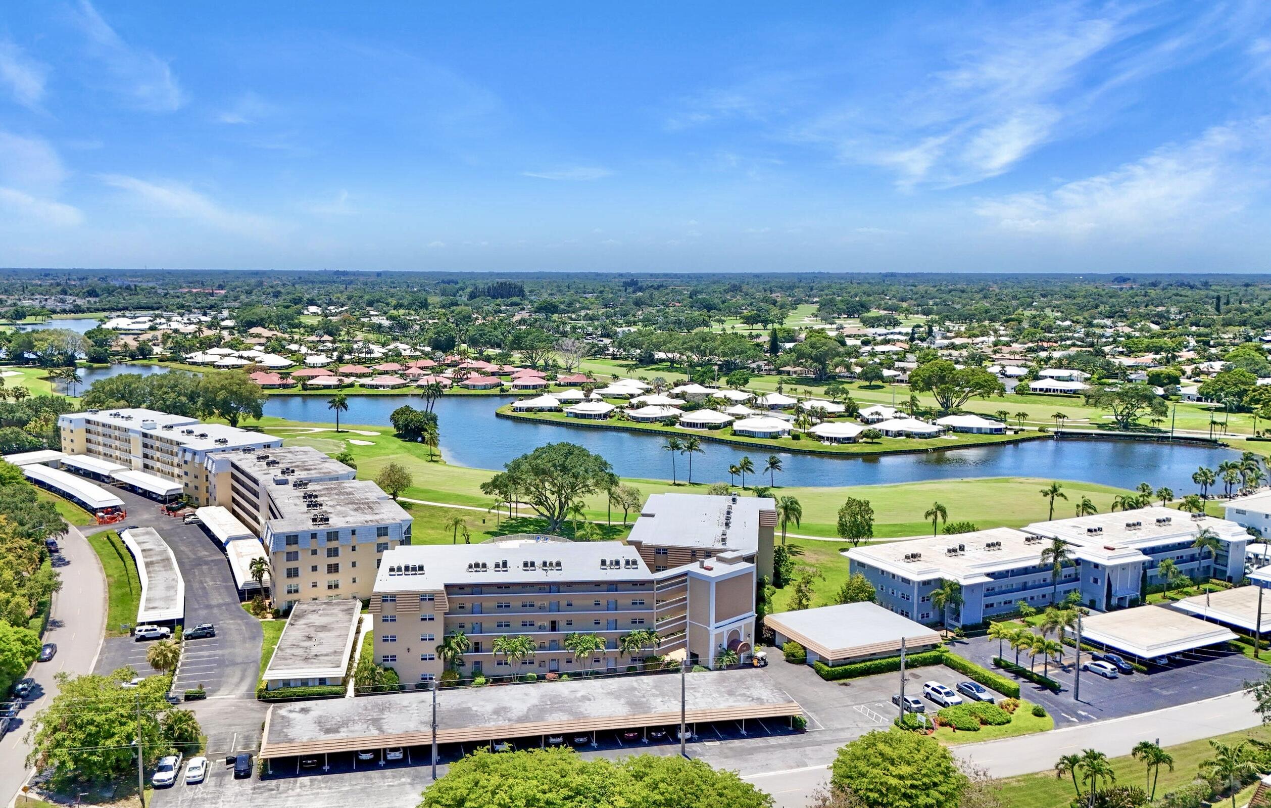 145 Atlantis Boulevard, Unit PH4 Atlantis, FL 33462 - Photo 25 of 27 an outdoor space with furniture and city view