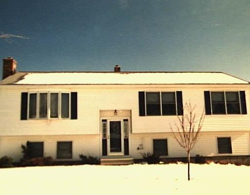 4 Menna Road Ansonia, CT 06401 - Photo 1 of 1 a front view of a house with a yard