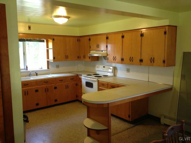 404 West Moorestown Road Nazareth, PA 18064 - Photo 4 of 12 a kitchen with a sink a stove and cabinets