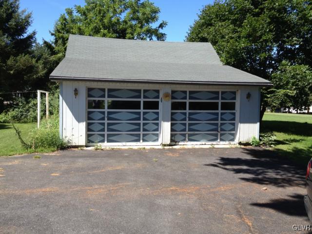 404 West Moorestown Road Nazareth, PA 18064 - Photo 9 of 12 a view of a house with a yard and garage