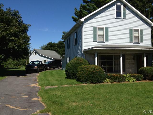 404 West Moorestown Road Nazareth, PA 18064 - Photo 10 of 12 a front view of a house with a yard and garage