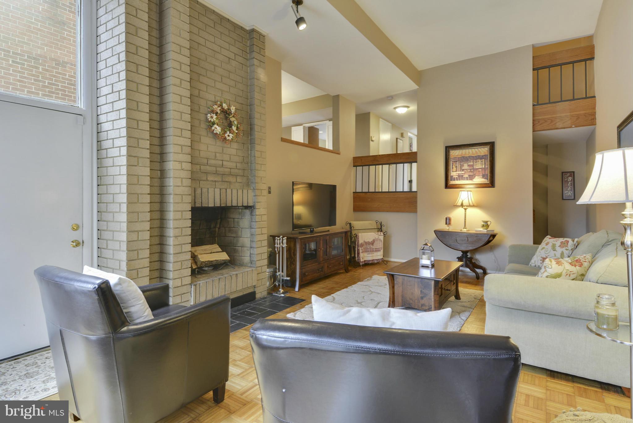 11706 Indian Ridge Road Reston, VA 20191 - Photo 11 of 30 a living room with furniture and a fireplace