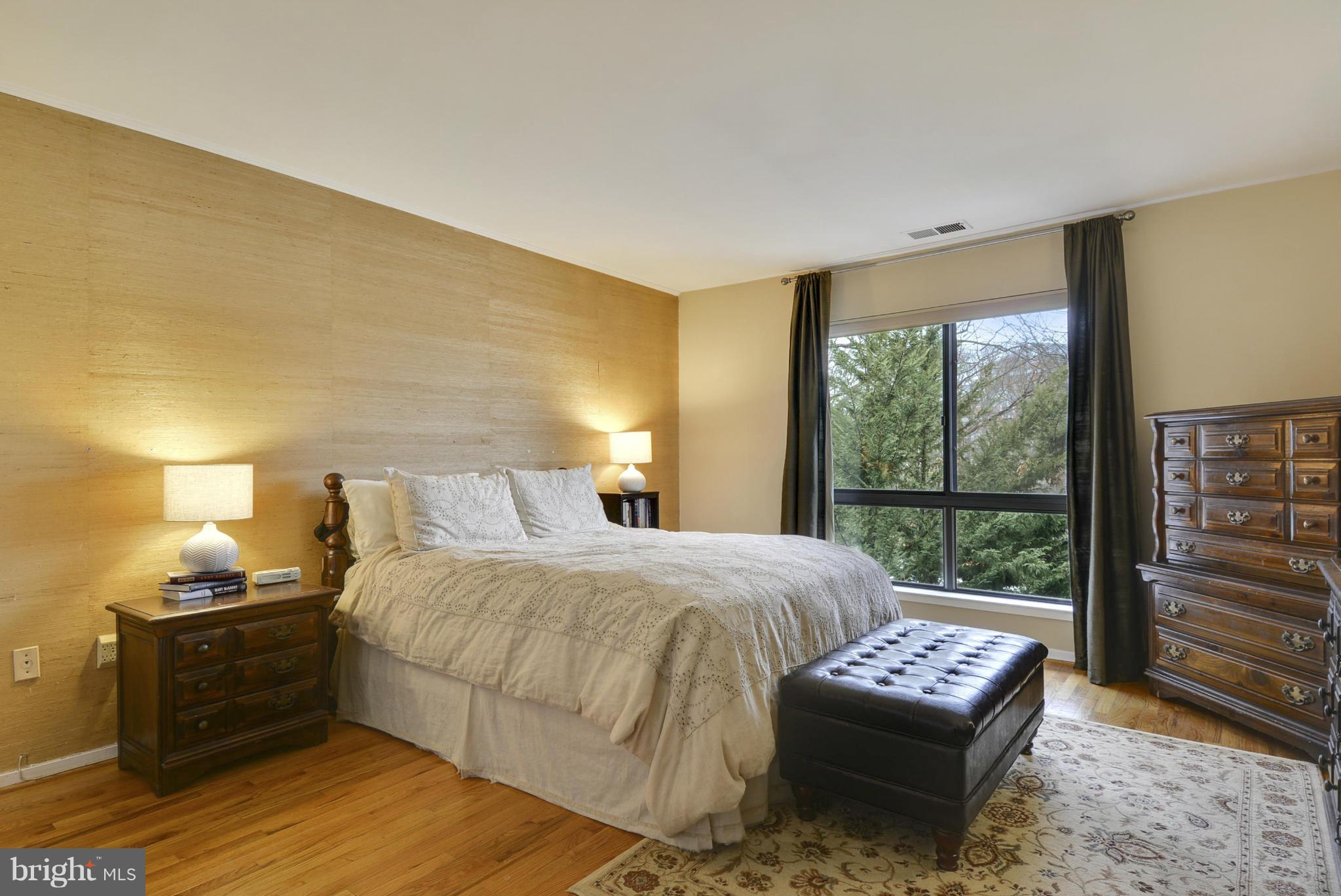11706 Indian Ridge Road Reston, VA 20191 - Photo 12 of 30 a bedroom with a bed and a window