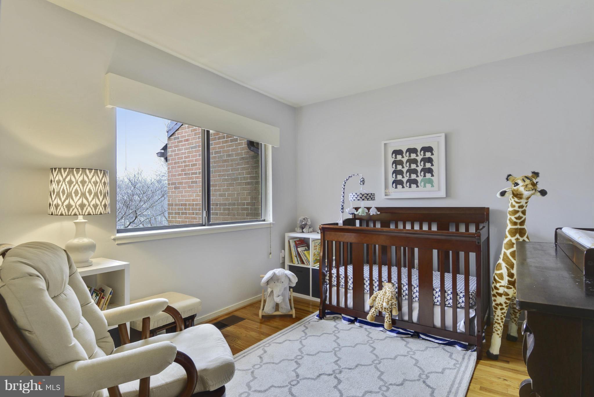 11706 Indian Ridge Road Reston, VA 20191 - Photo 17 of 30 a bedroom with furniture and a window