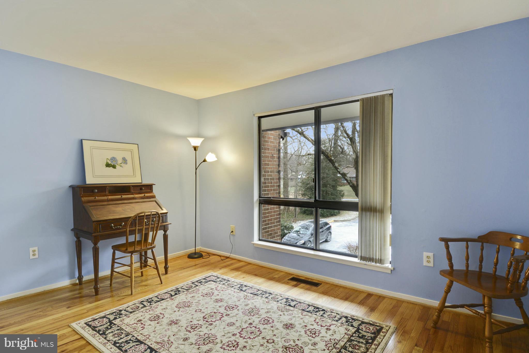 11706 Indian Ridge Road Reston, VA 20191 - Photo 19 of 30 a room with a piano table and chair