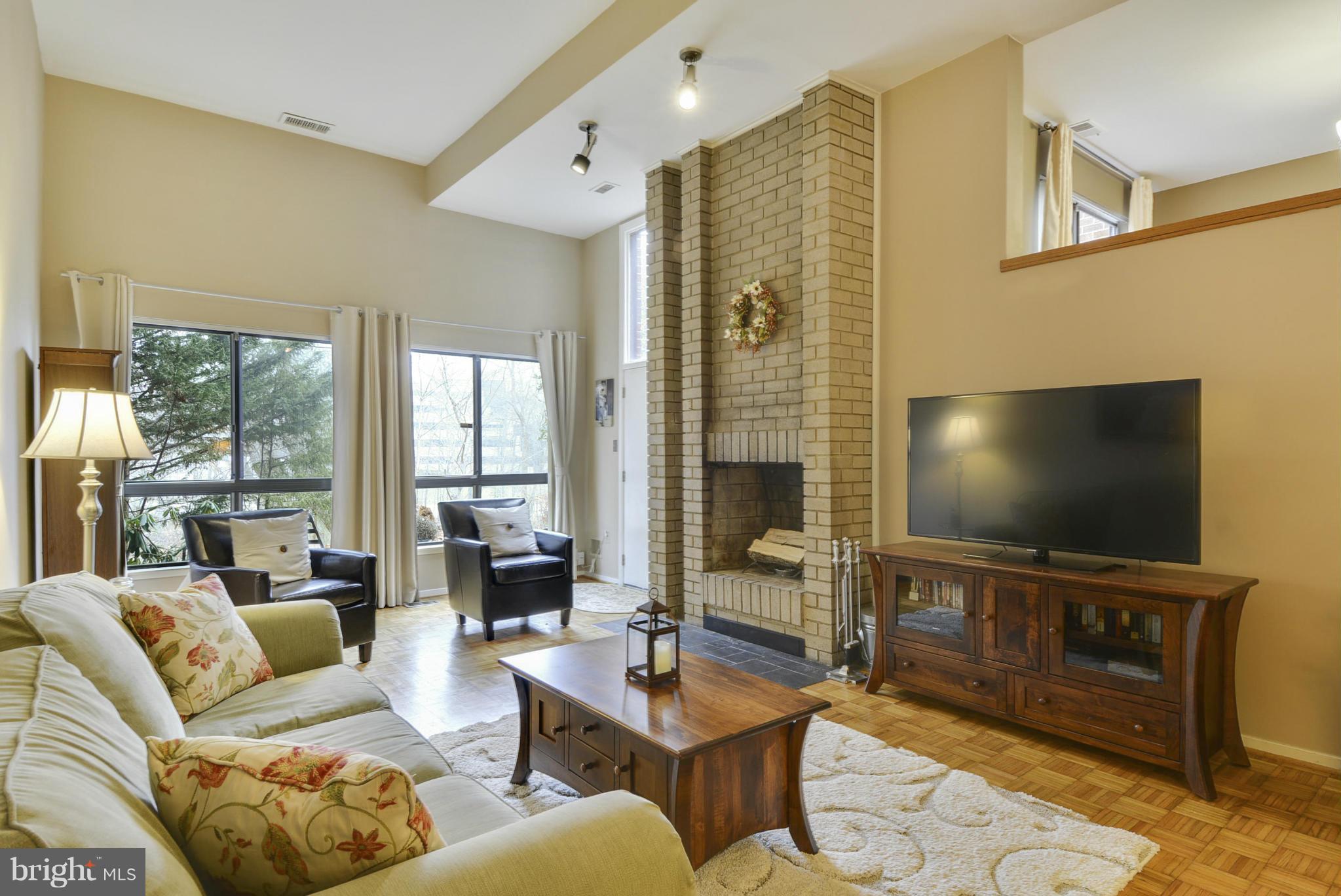 11706 Indian Ridge Road Reston, VA 20191 - Photo 10 of 30 a living room with furniture and a flat screen tv