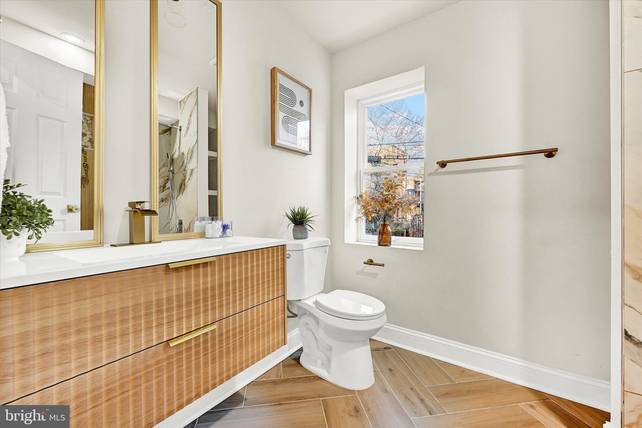 1304 Rutter Street Baltimore, MD 21217 - Photo 11 of 26 a bathroom with a sink toilet and shower