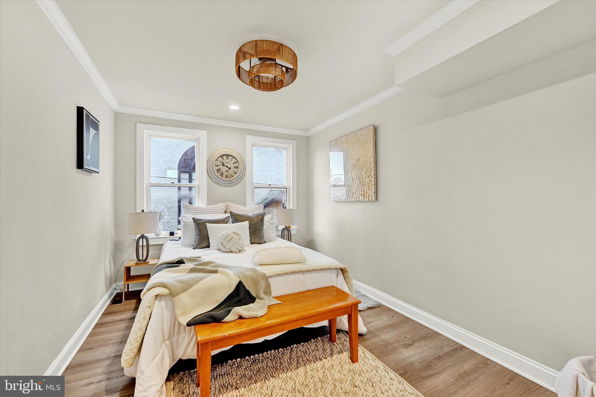 1304 Rutter Street Baltimore, MD 21217 - Photo 13 of 26 a bedroom with a bed and painting on the wall