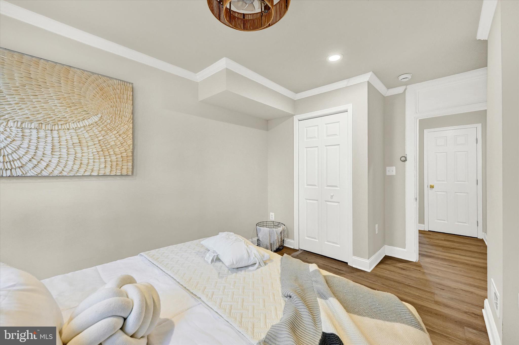 1304 Rutter Street Baltimore, MD 21217 - Photo 15 of 26 a bedroom with a bed and a painting on the wall