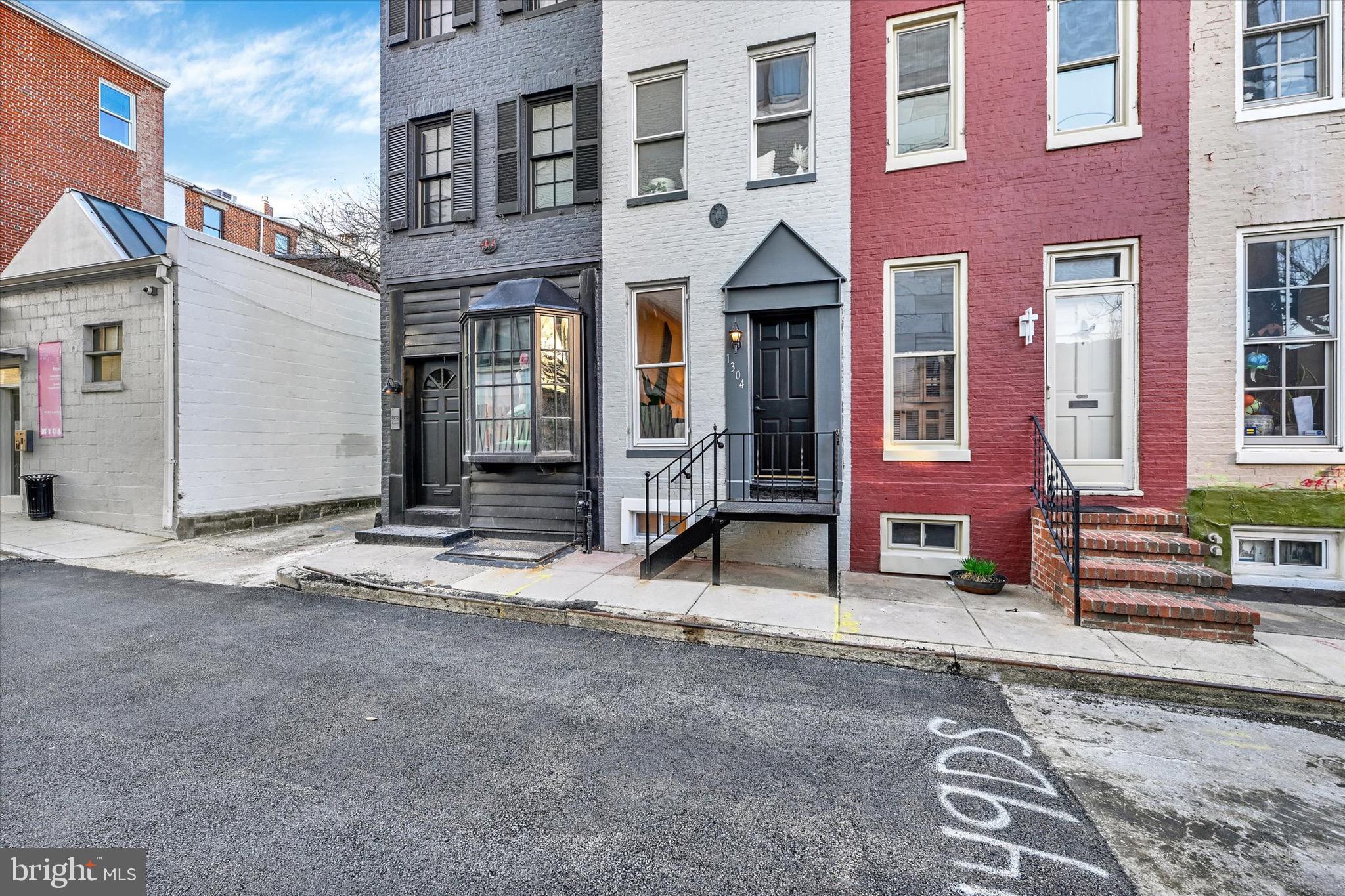 1304 Rutter Street Baltimore, MD 21217 - Photo 2 of 26 a view of a brick building with many windows