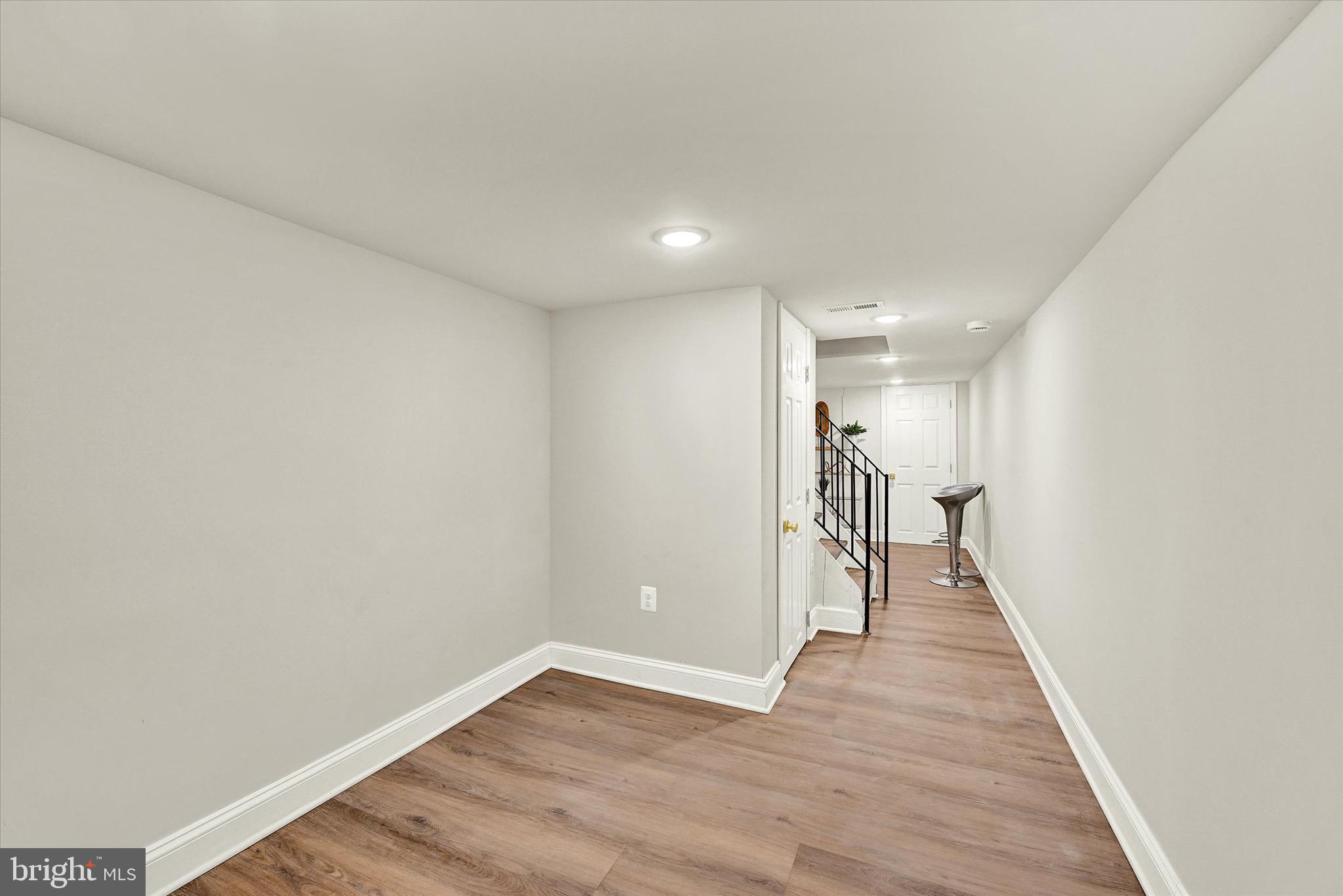 1304 Rutter Street Baltimore, MD 21217 - Photo 22 of 26 a view of entryway with wooden floor