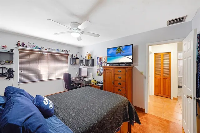 a bed room with a bed and a window