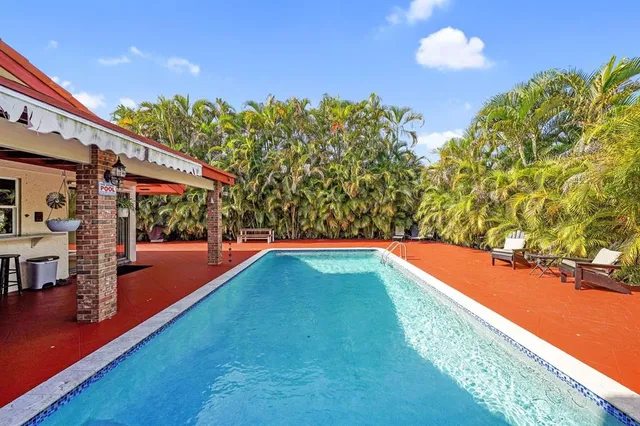 a view of swimming pool with a yard