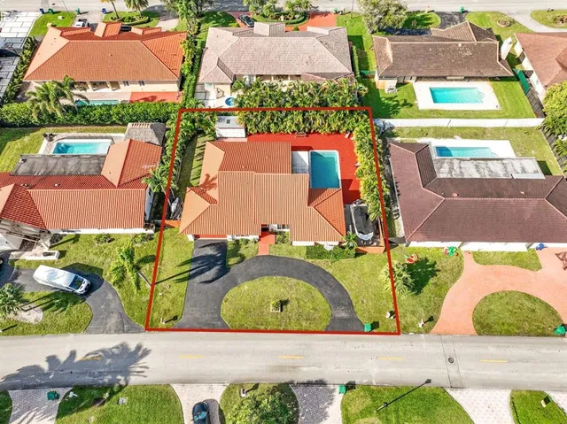 an aerial view of a house with a garden