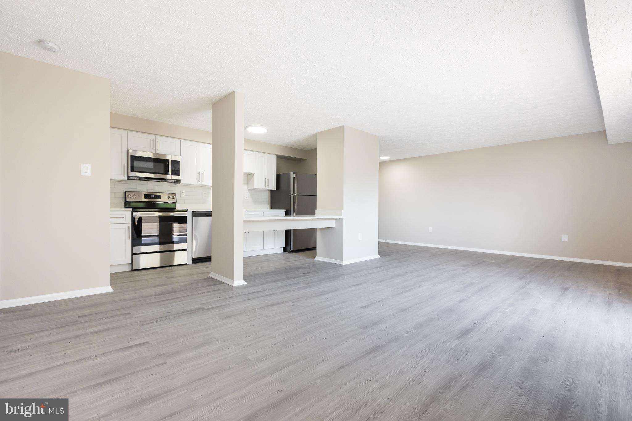 19505 Gunners Branch Road, Unit 733 Germantown, MD 20876 - Photo 12 of 42 Living/Dining/Kitchen