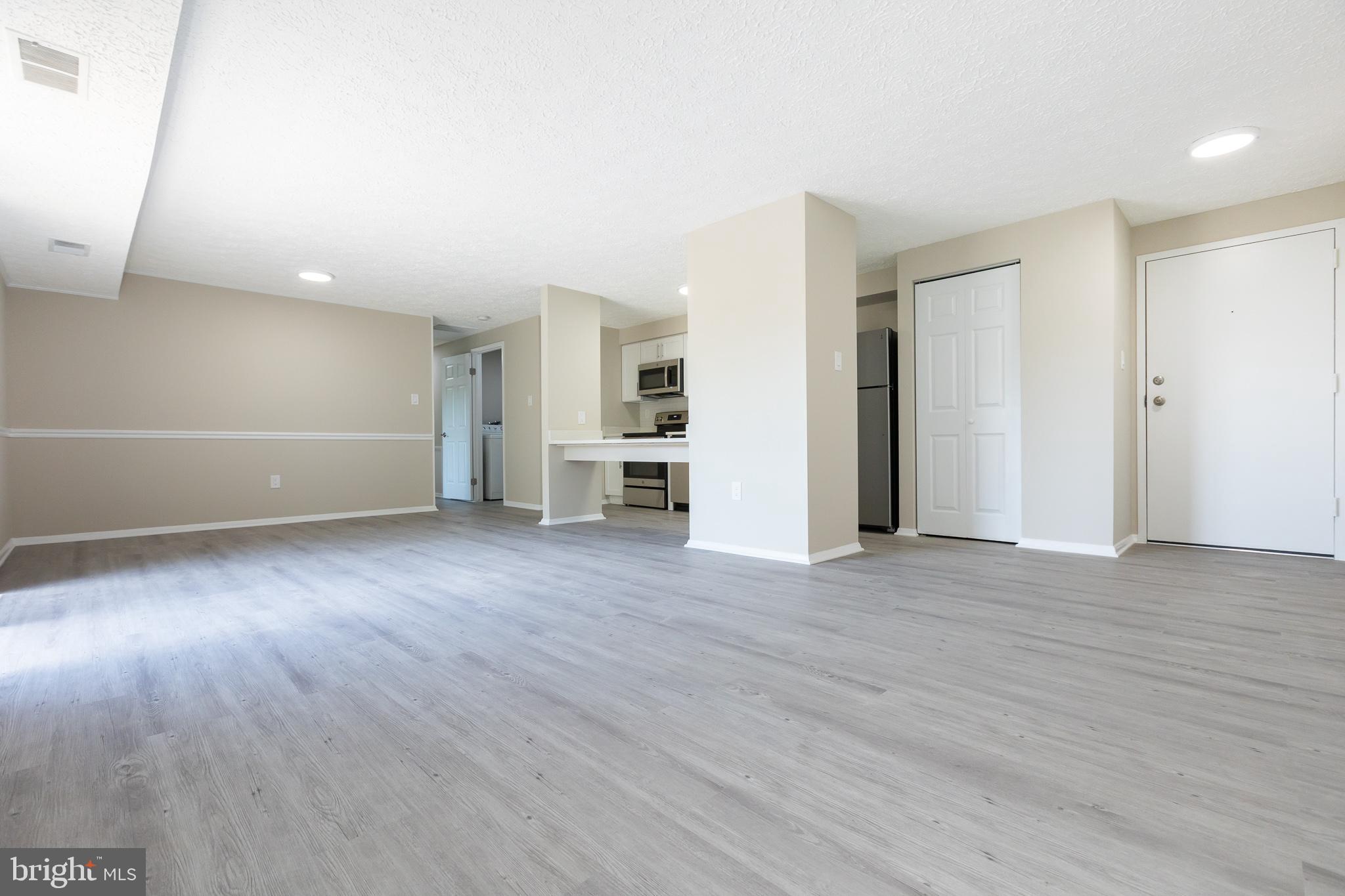 19505 Gunners Branch Road, Unit 733 Germantown, MD 20876 - Photo 13 of 42 Living/Dining/Kitchen