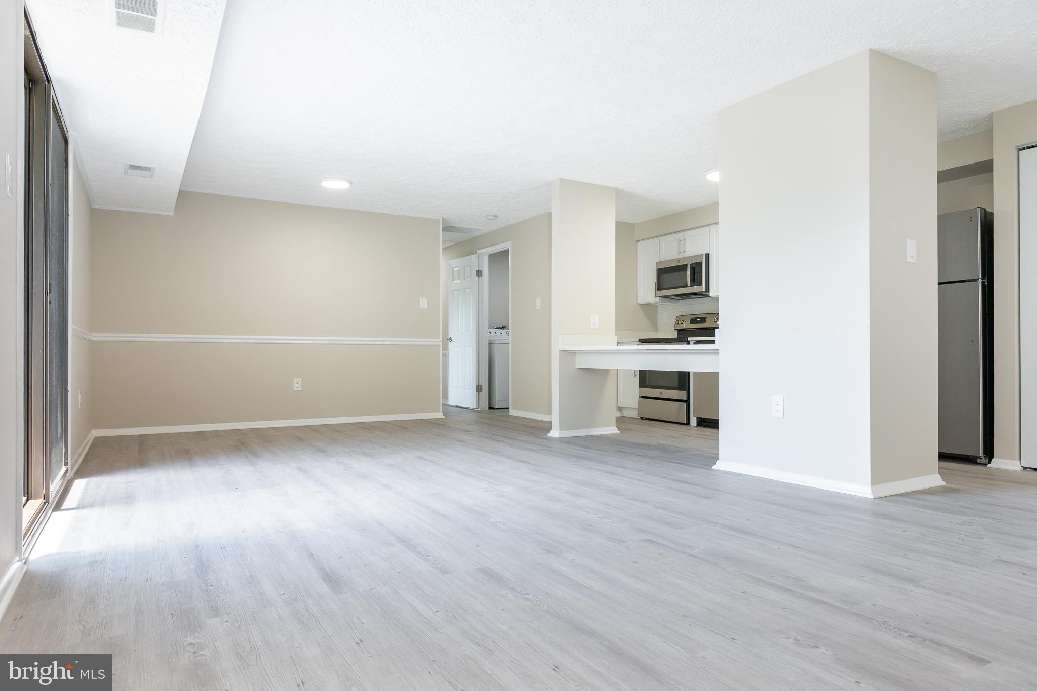 19505 Gunners Branch Road, Unit 733 Germantown, MD 20876 - Photo 14 of 42 Living/Dining/Kitchen