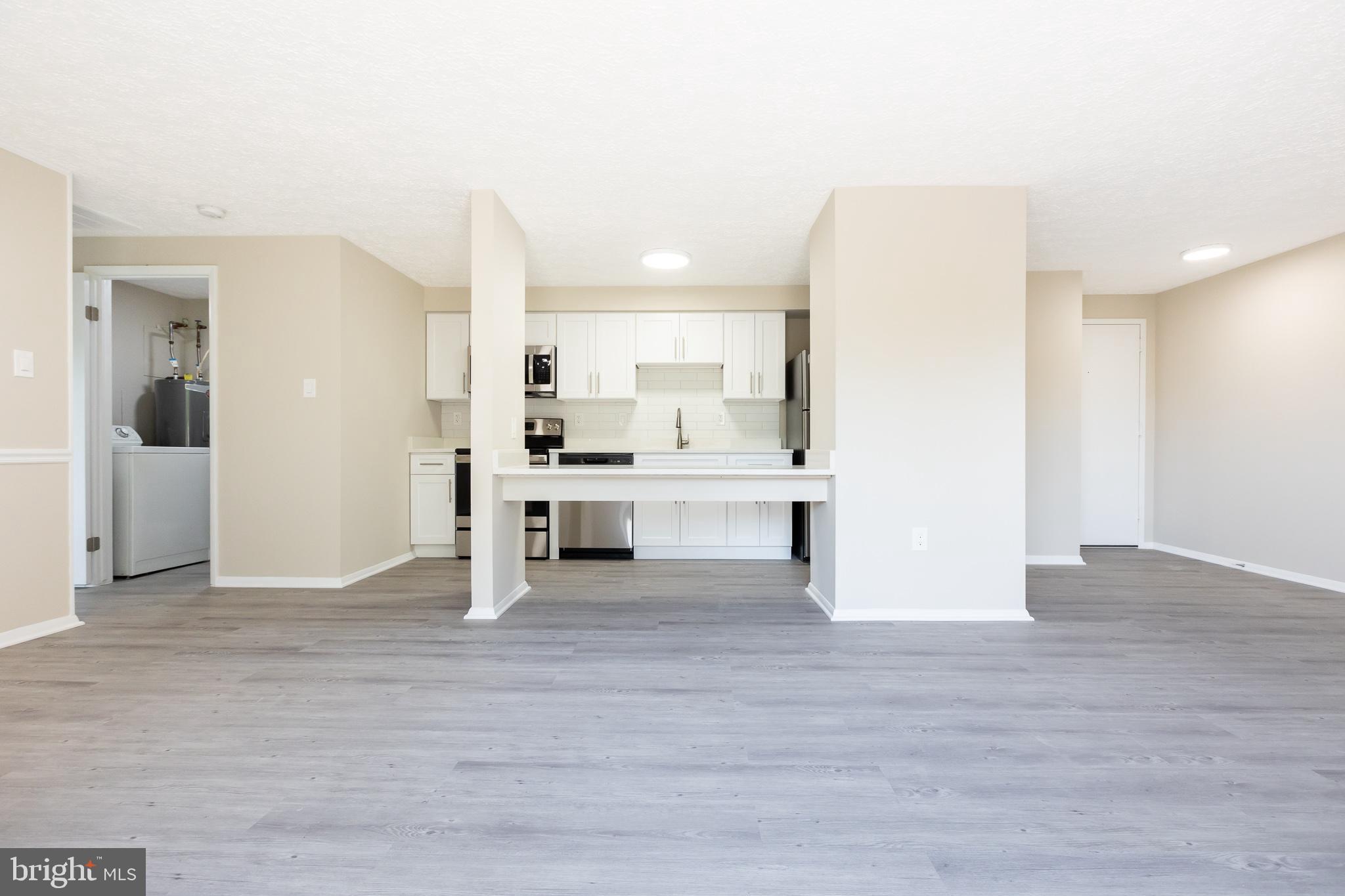 19505 Gunners Branch Road, Unit 733 Germantown, MD 20876 - Photo 15 of 42 Living/Dining/Kitchen