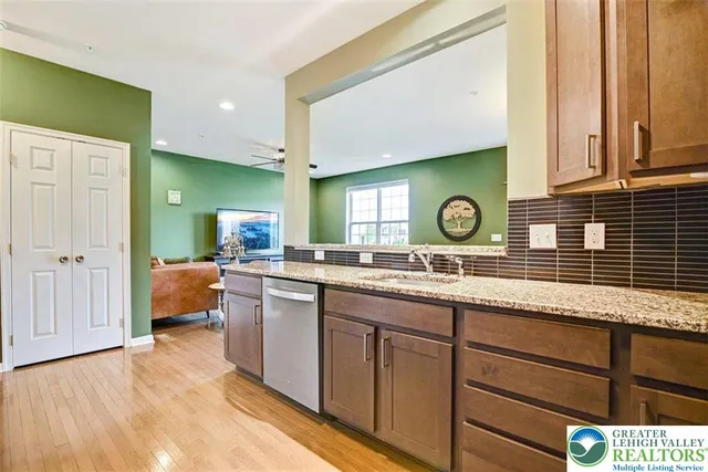a kitchen with lots of counter space and windows
