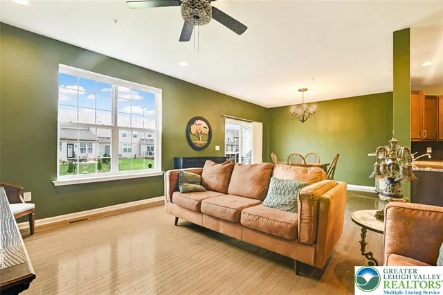 a living room with furniture and a window