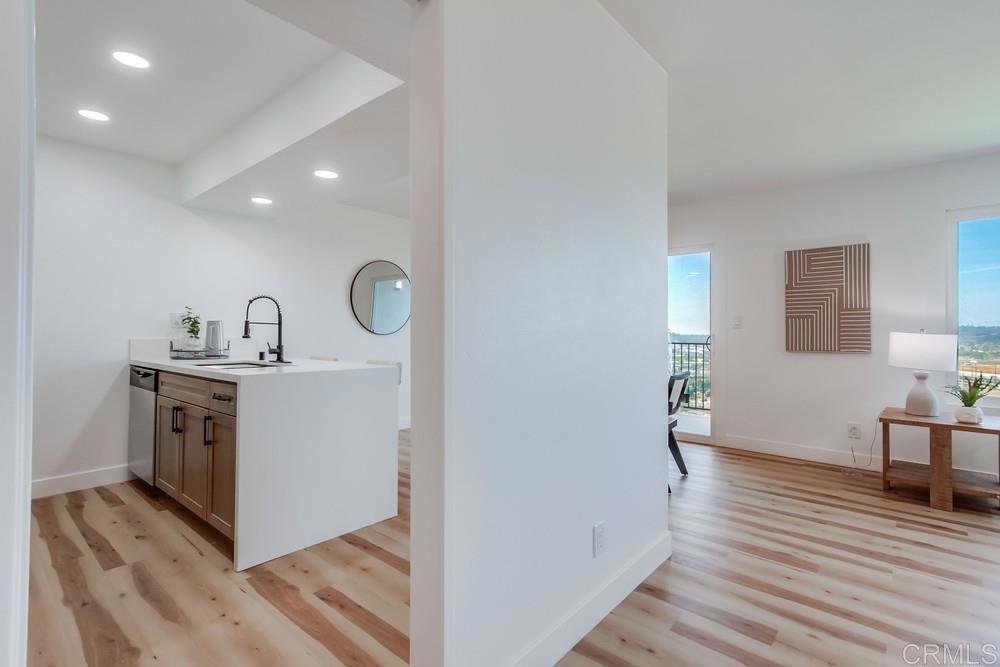 3606 Vista Rey, Unit 37 Oceanside, CA 92057 - Photo 13 of 45 a view of hallway with wooden floor
