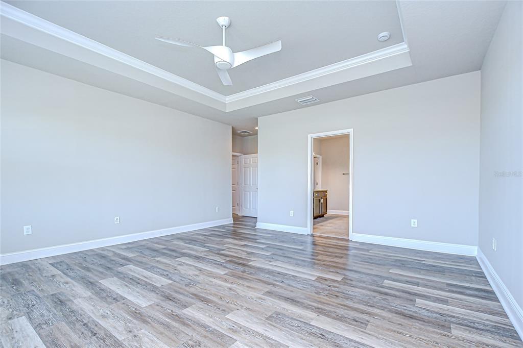 1018 Tracey Ann Loop Valrico, FL 33594 - Photo 21 of 45 a view of an empty room with wooden floor