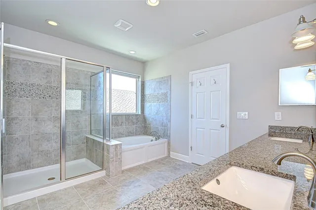a view of an empty room and wooden floor