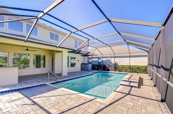 a view of a backyard with a patio