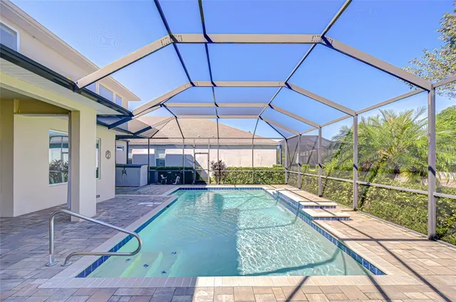 a kitchen with a sink stove and microwave