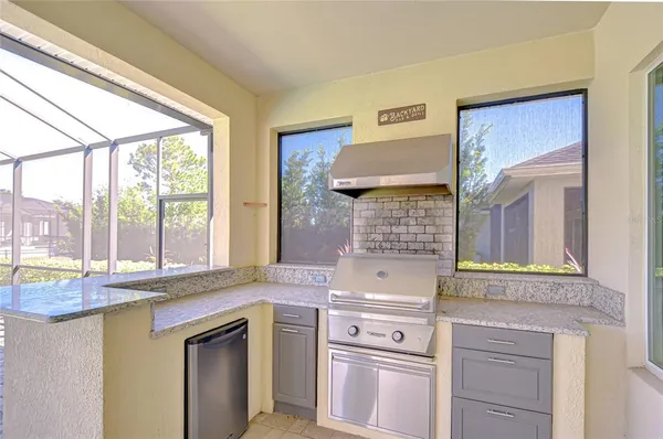 a front view of a house with outdoor seating