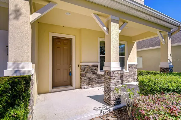 a view of a house with a yard and plants
