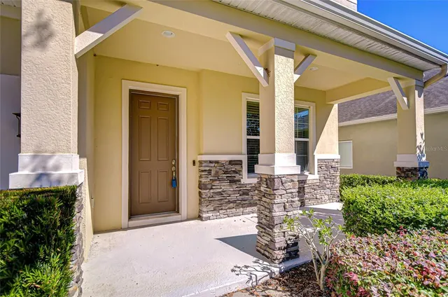 a view of a house with a yard and plants