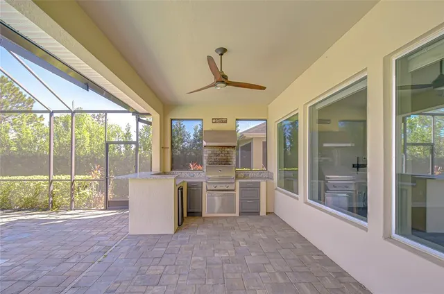 a view of kitchen with furniture and large windows