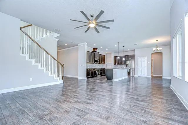 a view of kitchen with cabinets and wooden floor